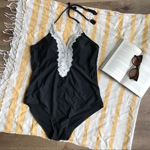 Black one-piece halter top swimsuit